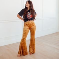 Add a chic twist to your wardrobe with the Golden Babe High Rise Velvet Flares Pants! A high banded waist tops these luxe stretch velvet pants with embossed pattern &, flared legs in a gold yellow. Pull on feature. Pair with a denim jacket and statement boots for a perfectly boho western look! Unlined. Color: Golden Yellow 30" Inseam 95% Polyester, 5% Spandex. Hand Wash Cold Wash Separately. Do Not Bleach. Lay Flat To Dry. Do Not Iron. Do Not Dry Clean. Velvet flare pants Velour flare pants Flar Velvet Flare Pants Outfit, Velvet Trousers Outfit, Nicole Fashion, Statement Boots, Stage Clothes, Velvet Flare Pants, Statement Heels, Trouser Outfit, Velvet Flares