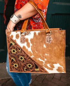 The sunflower   Tote is a stunning blend of rustic charm and modern sophistication. Crafted from high-quality leather, this purse features a captivating  body accentuated by intricate tooled leather panels in a rich brown hue. The detailed floral tooling showcases expert craftsmanship, adding a touch of timeless elegance to the design. Western Style Brown Bags For Daily Use, Western Style Leather Rectangular Shoulder Bag, Western Style Brown Satchel Bag, Hand-tooled Leather Bags For Western-themed Events, Western Style Rectangular Bags For Western-themed Events, Western-style Rectangular Bag For Western-themed Events, Western-style Rectangular Bags For Western-themed Events, Luxury Hand Tooled Leather Satchel, Western Style Hand Tooled Brown Bag