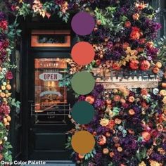 a building covered in lots of colorful flowers