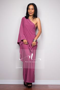 "One shoulder dress, Long pink dress, Off shoulder evening dress, dusty pink cocktail dress, pink party dress PRODUCT SIZE : Free Size * Chest : 40\" will stretch to 44\" * Waist : 40\" will stretch to 44\" * Hips : 40\" will stretch to 44\" * Sleeve length : 23\" * Length : 57\" - 58\" from shoulder to hem (measured when laying flat) MATERIAL : * ITY (polyester jersey) > soft and comfortable to wear, not as slippery as spandex. NOTE : * Model chest : 32\", waist : 24\" hips : 35\" * Combined Pre-draped One Shoulder Pink Dress, Cocktail One Shoulder Dress With Draped Sleeves, Cocktail One-shoulder Draped Dress, Cocktail One Shoulder Draped Dress, Pink Pre-draped Maxi Dress For Cocktail, Off-shoulder Pre-draped Evening Dress For Party, Pink Sleeveless Asymmetrical Formal Dress, Cocktail Evening Dress With Draped Sleeves And Asymmetrical Neckline, Pre-draped Off-shoulder Party Maxi Dress