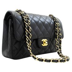 An authentic CHANEL Grained Calfskin Double Flap 9" Chain Shoulder Bag Black. The color is Black. The outside material is Leather. The pattern is Solid. This item is Contemporary. The year of manufacture would be 2017. Conditions & Ratings Outside material: Lambskin Color: Black Closure: Turn Lock Hardware and chain: Gold-Tone Made in France Serial sticker: Attached Comes with: Dust bag, Box, Care booklet Overall: 8 of 10 - The outside is in excellent condition with minimal signs of use only. NO Classic Flap Bag With Chain Strap, Gold Double Flap Bag With Chain Strap, Classic Textured Leather Flap Bag, Affordable Chanel Bag, Black Chanel Bag, Vintage Chanel Bag, Chanel Suit, Structured Shoulder, Chanel Brand