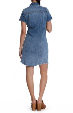 This casual-cool jean dress is designed with abbreviated sleeves and a feathery frayed hem. 35 1/2" front length; 36 1/2" back length Front button closure Spread collar Short sleeves 96% cotton, 3% polyester, 1% spandex Machine wash, tumble dry Imported Relaxed Fit Denim Dress With Frayed Hem, Cotton Denim Dress With Frayed Hem, Washed Blue Denim Dress With Frayed Hem, Dark Wash Denim Mini Dress With Frayed Hem, Dark Wash Denim Dress With Frayed Hem, Trendy Fitted Denim Dress With Frayed Hem, Denim Blue Dress With Frayed Hem, Trendy Dark Wash Dress With Frayed Hem, Casual Washed Blue Denim Dress With Frayed Hem