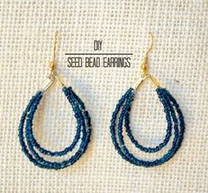 two pairs of blue beaded hoop earrings on a white cloth background with gold earwires