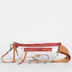 This updated take on our internet famous belt bag embraces the crossbody styling our fans have come to love, with size inclusivity in mind and a clear, stadium-approved twist. Plus, its long strap allows you to truly wear this style as a low slung crossbody, in addition to over your chest. Adorned with a hint of our croissant tan leather this pairing will have you celebrating in the end zone. Crafted with clear TPU and tan accent leather Brushed silver hardware, covered for life 11" L x 3.5" W x Size Inclusivity, Internet Famous, Festival Shop, Leather Cleaning, In The End, Leather Care, Shoulder Tote, Tote Backpack, Men's Collection