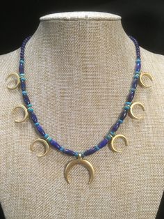 "Ancient style Lunula or Crescent moon necklaces with a variety of genuine gemstone options! Beautiful 22k gold plated pendants to compliment your ancient Roman, Greek, Parthian, Coptic or any other Bronze age persona! You can wear them with your prettiest T shirt and jeans outfit. Earrings that compliment these necklaces can be found in my Etsy shop here. https://www.etsy.com/listing/817662134/ancient-style-lunula-crescent-mooref=shop_home_active_2 These necklaces are finished with 14k gold fil Artisan Necklace With Moon Charm, Artisan Crescent Moon Charm Necklaces, Artisan Crescent Moon Charm Necklace, Artisan Crescent Jewelry Hand Forged, Artisan Hand Forged Crescent Jewelry, Artisan Hand-forged Crescent Jewelry, Unique Crescent Moon Charm Necklace, Artisan Crescent Moon Charm Jewelry, Artisan Gold Crescent Jewelry