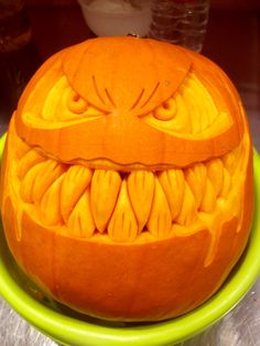 a pumpkin carved to look like an evil face