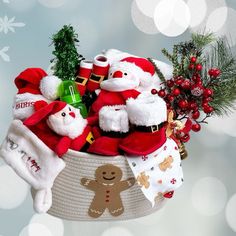 a basket filled with stuffed animals and santa hats