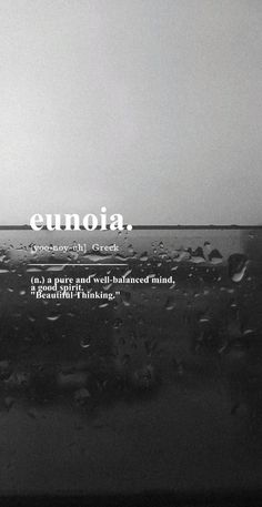 the words eunoia are written in white on a black and white background with water droplets