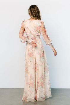 Looking for a perfect long sleeve maxi dress? This is it! Our Layla Tulle Maxi Dress is stunning in Romantic Floral. You'll wear it again and again! Flowy V-neck Dress With Smocked Cuffs, Flowy Spring Dress With Elastic Sleeves, Spring V-neck Dress With Smocked Cuffs, Elegant Spring Dress With Smocked Cuffs, V-neck Chiffon Dress With Smocked Bodice, Spring Flowy Maxi Dress With Elastic Sleeves, Spring Flowy Maxi Dress With Elastic Waistband, Elegant Maxi Dress With V-neck And Smocked Cuffs, Flowy Spring Dress With Smocked Cuffs