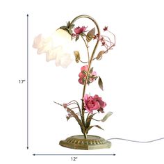 a flower lamp is shown with measurements for the light bulb and flowers on it's base