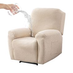 a person is pouring water into a recliner with the armrests extended and foot rest down