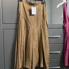 Never Worn. Size Xs Fits As Small. Has A Split In The Front. Absolutely Gorgeous. Chic Knee-length Gold Skirt, Chic Gold Flared Skirt, Gold Lined Maxi Skirt For Summer, Gold Fitted Maxi Skirt For Summer, Gold Midi Skirt For Summer, Spring Gold Flared Skirt, Gold Flared Skirt For Spring, Gold Long Skirt For Summer, Spring Gold Pleated Skirt