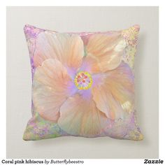 a pink and yellow flower pillow on a white background with the words hirsness tropical flowers by butterflybeestro