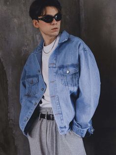 This basic denim jacket is modelled on classic trucker style featuring dual flap pockets and silver-tone metal buttons. Light-wash blue color easily incorporated into any wardrobe and oversized fit allows comfortable layering.- Collared neck- Button fastenings- Double chest pockets- Two fromt welt pockets- Adjustable buttoned tabs at back hem- Oversized fit Urban Style Medium Wash Denim Jacket With Pockets, Urban Denim Jacket With Pockets In Medium Wash, Blue Jeans Jacket Outfit Men, Oversized Denim Jacket With Buttoned Pockets For Winter, Classic Blue Denim Jacket With Flap Pockets, Light Blue Denim Jacket Outfit, Winter Blue Denim Jacket With Buttoned Pockets, Urban Medium Wash Denim Jacket With Pockets, Oversized Winter Denim Jacket With Buttoned Pockets