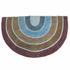 a brown and blue rug with circles on the bottom, in front of a white background