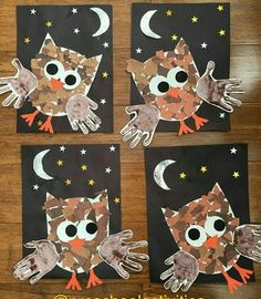 four owls made out of construction paper on top of a wooden table with stars and crescents