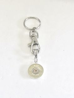 This would make a great shotgun shell keychain gift.  It has a cut shotgun shell head on it.  It would make a great gift to remind someone to shoot for the stars or a gift for the person that loves shooting sports - skeet, trap, or sporting clays. This item is a multi-purpose convertible piece and the pendant piece of this keychain can be "un-clipped" to wear on a chain or necklace if desired.  Each keychain comes individually gift boxed. This item contains small pieces and is not Shotgunning Necklace, Shotgun Shell Gifts For Him, Shell Gifts, Shotgun Shell Crafts, Shell Keychain, Bullet Crafts, Father Son Gifts, Sporting Clays, Shoot For The Stars