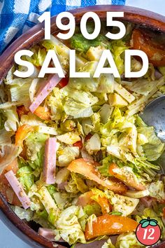 a bowl filled with salad next to a blue and white checkered table cloth