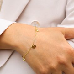 14K Gold-Plated Silver Bracelet with Elegant Heart Charms - A Timeless Expression of Love. 💖 Celebrate Love with Every Wrist Flick 💖 Introducing our exquisite 14K gold-plated silver bracelet, adorned with delicate heart charms. This bracelet isn't just an accessory; it's a symbol of love, affection, and the timeless bonds we share. Why You'll Adore This Bracelet: Elegant Heart Charms: Each heart charm is a reminder of love's enduring presence in our lives. Luxurious Craftsmanship: Crafted from Elegant Hypoallergenic Heart-shaped Charm Bracelet, Elegant Hypoallergenic Heart Charm Bracelet, Minimalist Metal Charm Bracelet For Valentine's Day, Valentine's Day Minimalist Metal Charm Bracelet, Minimalist Bracelet With Heart Charm As Gift For Her, Minimalist Bracelets With Heart Charm As Gift For Her, Elegant Dangle Charm Bracelet For Valentine's Day, Minimalist Metal Heart Bracelet As Gift, Minimalist Metal Heart Bracelet Gift