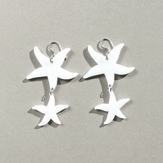 The Starfish earrings, made of upcycled acrylic, represent Renewal, Regeneration, Sensitivity and Perception. Sea stars is the symbol of mermaids and of the love goddess Venus. Replicating retro style of 60s, 70s and 80s earrings. We also have yellow color in stock: https://www.etsy.com/listing/659234755/ MATERIALS Made of UPCYCLED bright white acrylic which is a recycled Plexiglass plastic from various industries. Very lightweight with the 925 sterling silver ear wires. If you have particular c Upcycled Earrings, Acrylic Laser Cut, 80s Earrings, Sea Stars, Winter Earrings, Dragon Earrings, Earrings Acrylic, Laser Cut Earrings, Starfish Earrings