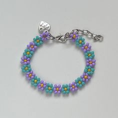 a bracelet with beads and charms on it