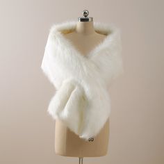 a white fur stole on a mannequin