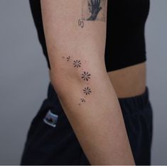 a woman with a tattoo on her arm