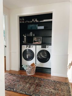 a washer and dryer in a small room