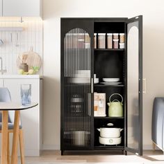 an open cabinet in the middle of a kitchen