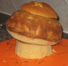 a loaf of bread sitting on top of an orange plate