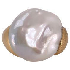 Yvel's signature, handmade 18k yellow Gold, Satin-finish is combined with high polish gold in this large Pearl Ring. Large Baroque Pearl is approximately 27mm x 29mm. Size 10 1/2 Stamped 750, and YVEL hallmark Luxury Oval Pearl Drop Ring, Luxury Heirloom Oval Pearl Ring, Ring Png, Baroque Pearls, Pearl Ring, Fashion Rings, Hallmark, Jewelry Rings, Yellow Gold