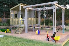 a child's play area with swings and toys