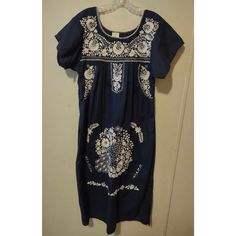 This Beautiful Navy Blue Dress Is A Must-Have Addition To Any Disney Parks Fan's Wardrobe. The Dress Features Intricate Embroidery And Is Made In Mexico With High-Quality Materials. The Dress Is A Size Small And Has A Blouson Style With A Midi-Length Hem. The Dress Is Perfect For Any Occasion And Can Be Dressed Up Or Down Depending On Your Preference. The Dress Is A Great Way To Show Off Your Love For Disney Parks While Also Looking Stylish And Chic. Don't Miss Out On This Amazing Dress! Casual Blue Dress With Embroidered Hem, Blue Cotton Dress With Embroidered Hem, Casual Blue Dress With Floral Embroidery, Fitted Casual Blue Embroidered Dress, Fitted Blue Embroidered Casual Dress, Blue Embroidered Short Sleeve Dress, Blue Fitted Short Sleeve Embroidered Dress, Blue Fitted Embroidered Cotton Dress, Blue Fitted Embroidered Dress With Short Sleeves