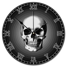 a black and white clock with a skull on it