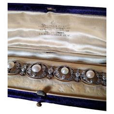 Exquisite Collector Edwardian/Belle Epoque Natural Pearl and Diamond Bracelet, fitted in its original case by Garrard & Co, circa 1900. The first official Crown Jeweler for the British royal family, Garrard & Co. Limited has crafted iconic and historically celebrated rings, watches, necklaces and other jewelry for centuries. An Edwardian pearl and diamond bracelet, consisting of eight oval-shaped diamond-set openwork links, each to the centre with a round natural pearl set between two old-cut di Antique Formal Bracelets With Box Clasp, Vintage Formal Bracelet With Box Clasp, Victorian White Gold Bracelets For Formal Occasions, Victorian Style White Gold Bracelets For Formal Occasions, Victorian Bracelets With 17 Jewels For Evening, Antique Evening Bracelets, Edwardian Jewelry, Pearl Set, Royal Jewelry