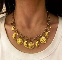 "Dalida" necklace  Moon and sun necklace This is a beautiful statement necklace made of two different types of steel chains .  Necklace is decorated with various charms made of gold plated zamac .  It is available in one length but due to the extra long extension chain , it can be adjusted to various lengths . Hypoallergenic/ sensitive friendly metal / excellent behaviour in time / super resistant  ⚜️Everything is taking place in a private clean organsized smoke-free studio.  ⚜️on some pieces , Statement Charm Necklace, Celestial Gold Necklace For Festival, Gold Moon Phase Necklace For Festivals, Celestial Necklace For Festivals, Bohemian Metal Jewelry With Chunky Chain, Gold Jewelry With Sun And Moon Design For Festivals, Gold Sun And Moon Design Jewelry For Festivals, Gold Sun And Moon Festival Jewelry, Celestial Brass Necklace With Adjustable Chain