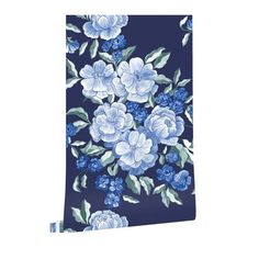 a blue and white flowered wall hanging