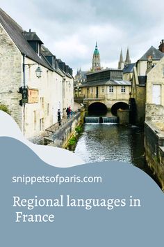 a river running through a small town next to tall buildings with text overlay that reads regional languages in france