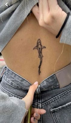 a woman with a tattoo on her stomach