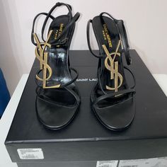 Authentic Cassandra Sandal. This Is The Strappy Version Where The Heel Is Uncovered. Worn Less Than 5 Times. Box And Dust Bags Included. Designer Sandals With Heel Strap, Designer Ankle Strap Heels With Heel Loop, Luxury Heels With Single Toe Strap And Branded Insole, Designer Flats With Removable Insole, Luxury Sandals With Wrapped Heel, Luxury Gold Flat Heels, Designer Closed Toe Sandals With Heel Strap, Luxury Sandals With Heel Strap And Flat Heel, Designer Closed Toe Sandals With Heel Loop