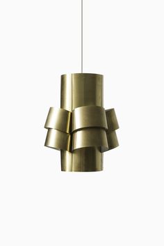 a brass colored light fixture hanging from a ceiling