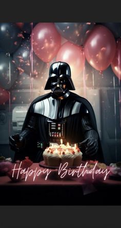 a darth vader birthday cake with candles and balloons in the background that says happy birthday