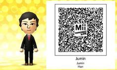 a man in a suit and tie next to a qr code with the name mii on it