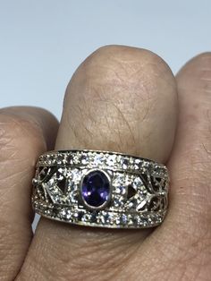 Unusual Deep Toned Amethyst Sterling Filigree Setting Accented with White Sapphires Handmade Size 6.5 Can be resized, my jeweler charges $10-$20 All rings are shipped in a nice gift box. Check out our over a THOUSAND great reviews Engraving is $4 per letter and is not always perfect depending on the piece. It can take a few days if the jeweler is busy. This is payable to Paypal Judithsltd@gmail.com Silver Hallmarked Amethyst Ring For Anniversary, Unique Amethyst Ring With Stone Setting For Anniversary, Purple 925 Stamped Jewelry For Anniversary, Purple Anniversary Jewelry, Classic Silver Amethyst Ring With Multi-stone, Silver Amethyst Ring Collectible, Silver Amethyst Collectible Ring, Silver Multi-stone Amethyst Ring Fine Jewelry, Purple Amethyst Ring Fine Jewelry