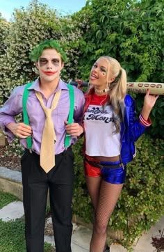 two people dressed up as the joker and person holding a baseball bat in their hands