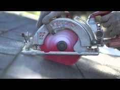 a person using a circular saw to cut wood