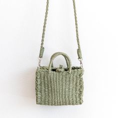 IN STOCK. SHIPPING FROM LOS ANGELES. FAST PROCESSING. Chic simple straw woven tote bag perfect for all occasions. Size: 20cm x 15cm x 10cm Strap length: 140cm (55 inches) Strap drop length: 4 inches Designer Style ID: 8499 Beneath its classic design, this bag offers fashionable functionality with a generously sized interior and an adjustable shoulder strap for convenience. Crafted with quality, this accessory is sure to be your go-to item for years to come. Green Square Straw Bag For Vacation, Casual Braided Rectangular Bucket Bag, Green Top Handle Straw Bag For Vacation, Rectangular Straw Bag For Spring, Casual Green Rectangular Straw Bag, Summer Picnic Square Shoulder Bag, Summer Green Rectangular Bucket Bag, Spring Braided Rectangular Bag, Spring Rectangular Braided Bags