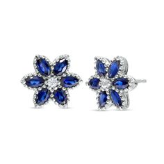 Achieve a feminine look with the whimsical details and sophisticated color of these bright blue and white lab-created sapphire flower stud earrings. Fashioned in sterling silver Each flower-shaped earring showcases six 4.0 x 2.0mm marquise-cut blue lab-created sapphires in beaded frames. A dainty white lab-created sapphire shimmers at the center. These post earrings secure comfortably with friction backs.