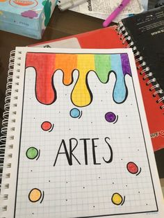 a notebook with the word arts written on it