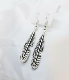 Silver feathers with a antique finish. Mounted on surgical stainless steel wires so they are hypoallergenic. Feather Earrings Silver, Pierced Jewelry, Silver Feather, Stainless Steel Wire, Feather Earrings, Antique Finish, Earrings Silver, Antique Silver, Feathers